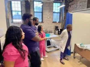 CNA Programs In Philadelphia What 4 Week CNA Programs In Philadelphia Are Near Me? Looking to become a Certified Nurse Aide CNA in Philadelphia, Pennsylvania fast? We discuss options to get your CNA training fast, in just 4 weeks! 4 Week CNA programs in Philadelphia are running now. What Is a CNA Nursing Assistant /Nurse Aide? A nursing assistant or nurse aide (generally referred to as a CNA, assists patients with daily activities, maintains patient hygiene and serves a vital role on the healthcare team. What Does a Nursing Assistant CNA Do? Students look on and learn in the hands-on classroom and lab setting of CareBridge Academy’s 4 week nurse aide CNA training program. You will offer patients compassion, empathy, and patience while assisting them with tasks such as dressing, bathing and feeding. You may also support doctors and nurses in diagnostic procedures and technical treatments. Certified nursing assistants or nurse aides (CNAs) also typically assist in patient charting and instruction, documenting any care that is given and reporting significant observations to the nursing staff. What Will I Learn With This 4 week CNA Program Training? As a student in the 4 week CNA course Nursing Assistant / Nurse Aide program, you’ll learn how to: assist in a broad range of areas including infection control, safety and emergency procedures document patient care services and report observations to the nursing staff assist doctors and nurses in diagnostic procedures and therapeutic treatments develop communication and interpersonal skills. What Career Opportunities Do CNA Nursing Assistants/Nurse Aide’s Have after they complete the 4 week CNA program in Philadelphia? Nursing assistants enjoy great job security and often work a flexible schedule. Typical work environments include: Clinics Hospitals home healthcare agencies long-term care facilities retirement communities assisted living facilities The NA program is quick, thorough, current and relevant with courses that offer you great experience and the ability to get into the healthcare field in a matter of weeks Upon completion of the CNA program, graduates will be prepared for a rewarding career as a: nursing assistant home health aide Caregiver personal care aide personal care attendant personal care assistant companion care provider What Kind of Training Do You Need to Become a Nursing Assistant? While in school to be a nurse aide, you will be instructed on a broad range of subjects, including infection control, communication and interpersonal skills. Topics also include safety and emergency procedures, personal care skills, psychosocial needs, basic restorative services and skills, basic nursing skills, quality improvement and more. The training is comprehensive yet can be completed with some programs in only 4 weeks! What is the employment outlook for nurse aides and nursing assistants in Philadelphia, Pennsylvania? The employment outlook is excellent for certified nurse aides (CNAs) in Philadelphia. According to the BLS, job growth will average 8 percent through 2030. The median pay is over $30,000 a year nationally, and that rate is higher locally in Philadelphia. Also, the level of current jobs available for nurse aides is very high locally. A search on Indeed.com shows over 2,000 jobs available for CNAs in Philadelphia! The reasons for this are due to demand. Philadelphia is a large city with an aging population. Because of this, older adults tend to have the greatest need for healthcare resources such as CNAs. What 4 Week CNA Programs Are Offered in Philadelphia? Nurse Teel is one of CareBridge Academy’s esteemed instructors in the 4 week CNA program. Many interested students will be delighted to learn that there are in fact CNA programs in Philadelphia that can be completed in 4 weeks! CareBridge Academy is a CNA school for nurse aides and nursing assistants that offers such a program, for example. The best part is, these classes are day options and start each and every 4 weeks! Regardless of the class or schedule you choose, the classes consist of 100 hours of training. This training is done with a mix of classroom, laboratory, and hands-on practice in a clinical setting. Are there other nurse aide and nursing assistant course options available? Not at this time. CareBridge Academy offers day classes that run monthly from 8:30 AM to 3:00 PM. This is an accelerated course. Can I take the 4 week CNA nurse aide program in Philadelphia for a low cost? Yes! The CareBridge Academy program is cost effective. Not only can you complete a 4 week CNA program in Philadelphia at CareBridge Academy, but you can do it for $1845 (or less with a paid in full discount. Do I have to pay the full cost of the 4 week CNA program up front? No, there is no requirement to pay the full program when registering, but if you do pay in full at the time of registration, you will receive a $100 discount. In fact, you only need to pay a $250 enrollment fee to secure your spot! Please note that all fees must be paid before your class start date otherwise you will be disenrolled from the course. There are no payment plans available at this time. What is the cost of the enrollment fee? The enrollment fee is $250 to reserve your spot. Is there an opportunity to take the 4 week CNA program in Philadelphia for free? Potentially. For starters, students can take the 4 week CNA program and pay for it. If that graduating student then works in a nursing home or long term care facility for a total of 260 hours, that facility is required to reimburse the student the full cost of their program training! Students can also get reimbursed for their state testing fees as well. In this case, if a student takes the 4 week CNA program in Philadelphia at CareBridge Academy and pays $1845 then the $135 state testing fee, then the long term care facility they work at must reimburse their fees in the following breakdown: half of the total cost is reimbursed after working at the facility for 130 hours. In this scenario, that would be $765. The second $765 would be paid by the employee’s facility after another 130 hours are worked. This, in effect, means that the student did not have to pay the cost of the program. How do I learn more about the 4 week CNA Program at CareBridge Academy? For those interested in learning more about the nurse aide training reach out to CareBridge Academy today! Call us at 267-448-0803 or contact us directly here. CNA Programs In Philadelphia What 4 Week CNA Programs In Philadelphia Are Near Me? Looking to become a Certified Nurse Aide CNA in Philadelphia, Pennsylvania fast? We discuss options to get your CNA training fast, in just 4 weeks! 4 Week CNA programs in Philadelphia are running now. What Is a CNA Nursing Assistant /Nurse Aide? A nursing assistant or nurse aide (generally referred to as a CNA, assists patients with daily activities, maintains patient hygiene and serves a vital role on the healthcare team. What Does a Nursing Assistant CNA Do? Students look on and learn in the hands-on classroom and lab setting of CareBridge Academy’s 4 week nurse aide CNA training program. You will offer patients compassion, empathy, and patience while assisting them with tasks such as dressing, bathing and feeding. You may also support doctors and nurses in diagnostic procedures and technical treatments. Certified nursing assistants or nurse aides (CNAs) also typically assist in patient charting and instruction, documenting any care that is given and reporting significant observations to the nursing staff. What Will I Learn With This 4 week CNA Program Training? As a student in the 4 week CNA course Nursing Assistant / Nurse Aide program, you’ll learn how to: assist in a broad range of areas including infection control, safety and emergency procedures document patient care services and report observations to the nursing staff assist doctors and nurses in diagnostic procedures and therapeutic treatments develop communication and interpersonal skills. What Career Opportunities Do CNA Nursing Assistants/Nurse Aide’s Have after they complete the 4 week CNA program in Philadelphia? Nursing assistants enjoy great job security and often work a flexible schedule. Typical work environments include: Clinics Hospitals home healthcare agencies long-term care facilities retirement communities assisted living facilities The NA program is quick, thorough, current and relevant with courses that offer you great experience and the ability to get into the healthcare field in a matter of weeks Upon completion of the CNA program, graduates will be prepared for a rewarding career as a: nursing assistant home health aide Caregiver personal care aide personal care attendant personal care assistant companion care provider What Kind of Training Do You Need to Become a Nursing Assistant? While in school to be a nurse aide, you will be instructed on a broad range of subjects, including infection control, communication and interpersonal skills. Topics also include safety and emergency procedures, personal care skills, psychosocial needs, basic restorative services and skills, basic nursing skills, quality improvement and more. The training is comprehensive yet can be completed with some programs in only 4 weeks! What is the employment outlook for nurse aides and nursing assistants in Philadelphia, Pennsylvania? The employment outlook is excellent for certified nurse aides (CNAs) in Philadelphia. According to the BLS, job growth will average 8 percent through 2030. The median pay is over $30,000 a year nationally, and that rate is higher locally in Philadelphia. Also, the level of current jobs available for nurse aides is very high locally. A search on Indeed.com shows over 2,000 jobs available for CNAs in Philadelphia! The reasons for this are due to demand. Philadelphia is a large city with an aging population. Because of this, older adults tend to have the greatest need for healthcare resources such as CNAs. What 4 Week CNA Programs Are Offered in Philadelphia? Nurse Teel is one of CareBridge Academy’s esteemed instructors in the 4 week CNA program. Many interested students will be delighted to learn that there are in fact CNA programs in Philadelphia that can be completed in 4 weeks! CareBridge Academy is a CNA school for nurse aides and nursing assistants that offers such a program, for example. The best part is, these classes are day options and start each and every 4 weeks! Regardless of the class or schedule you choose, the classes consist of 100 hours of training. This training is done with a mix of classroom, laboratory, and hands-on practice in a clinical setting. Are there other nurse aide and nursing assistant course options available? Not at this time. CareBridge Academy offers day classes that run monthly from 8:30 AM to 3:00 PM. This is an accelerated course. Can I take the 4 week CNA nurse aide program in Philadelphia for a low cost? Yes! The CareBridge Academy program is cost effective. Not only can you complete a 4 week CNA program in Philadelphia at CareBridge Academy, but you can do it for $1845 (or less with a paid in full discount. Do I have to pay the full cost of the 4 week CNA program up front? No, there is no requirement to pay the full program when registering, but if you do pay in full at the time of registration, you will receive a $100 discount. In fact, you only need to pay a $250 enrollment fee to secure your spot! Please note that all fees must be paid before your class start date otherwise you will be disenrolled from the course. There are no payment plans available at this time. What is the cost of the enrollment fee? The enrollment fee is $250 to reserve your spot. Is there an opportunity to take the 4 week CNA program in Philadelphia for free? Potentially. For starters, students can take the 4 week CNA program and pay for it. If that graduating student then works in a nursing home or long term care facility for a total of 260 hours, that facility is required to reimburse the student the full cost of their program training! Students can also get reimbursed for their state testing fees as well. In this case, if a student takes the 4 week CNA program in Philadelphia at CareBridge Academy and pays $1845 then the $135 state testing fee, then the long term care facility they work at must reimburse their fees in the following breakdown: half of the total cost is reimbursed after working at the facility for 130 hours. In this scenario, that would be $765. The second $765 would be paid by the employee’s facility after another 130 hours are worked. This, in effect, means that the student did not have to pay the cost of the program. How do I learn more about the 4 week CNA Program at CareBridge Academy? For those interested in learning more about the nurse aide training reach out to CareBridge Academy today! Call us at 267-448-0803 or contact us directly here.