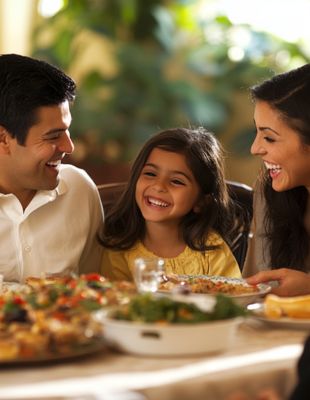 Happy family smiling and enjoying a screen-free meal together at home, promoting healthy family connection and screen time boundaries. Happy family smiling and enjoying a screen-free meal together at home, promoting healthy family connection and screen time boundaries.