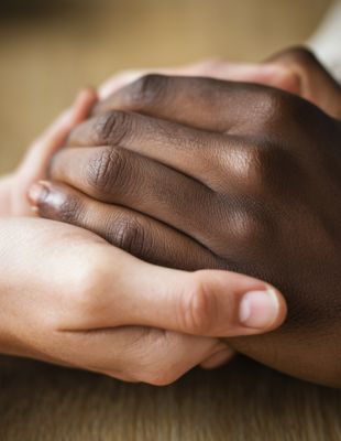 Interracial couple showing emotional support through touch – trust-building therapy Parkhurst, Johannesburg Interracial couple showing emotional support through touch – trust-building therapy Parkhurst, Johannesburg