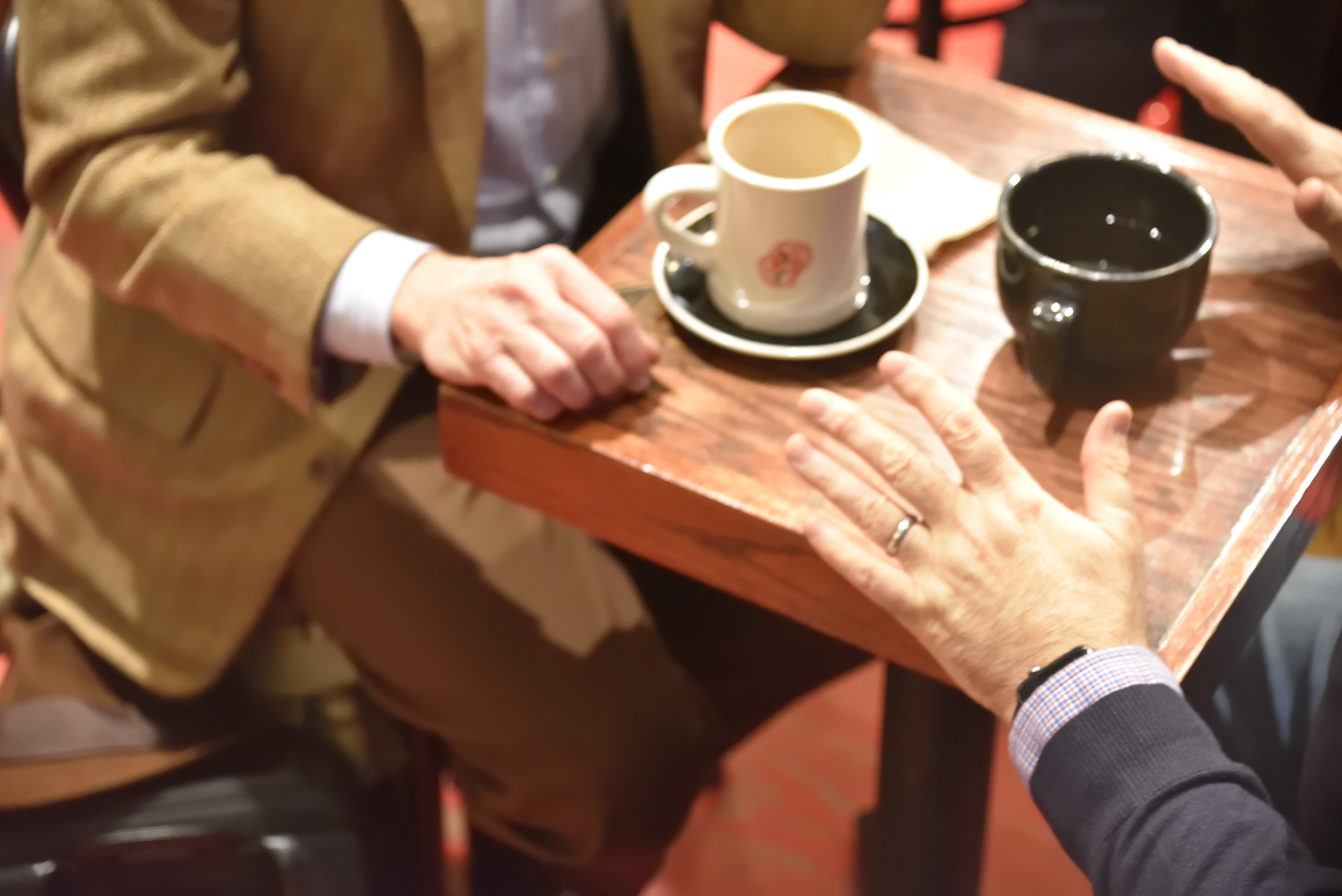 two people having coffee close up
