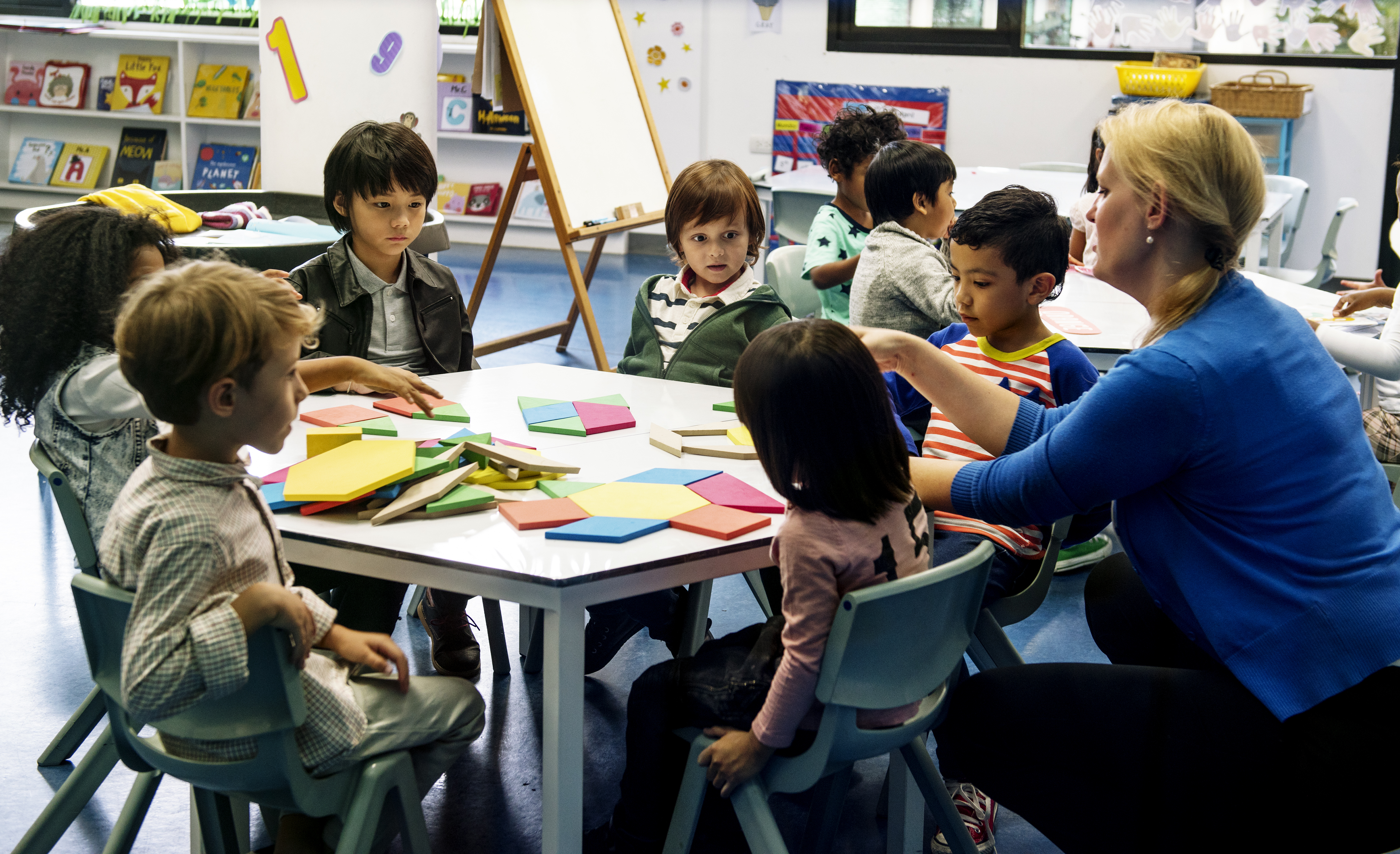children coloring at a table children coloring at a table