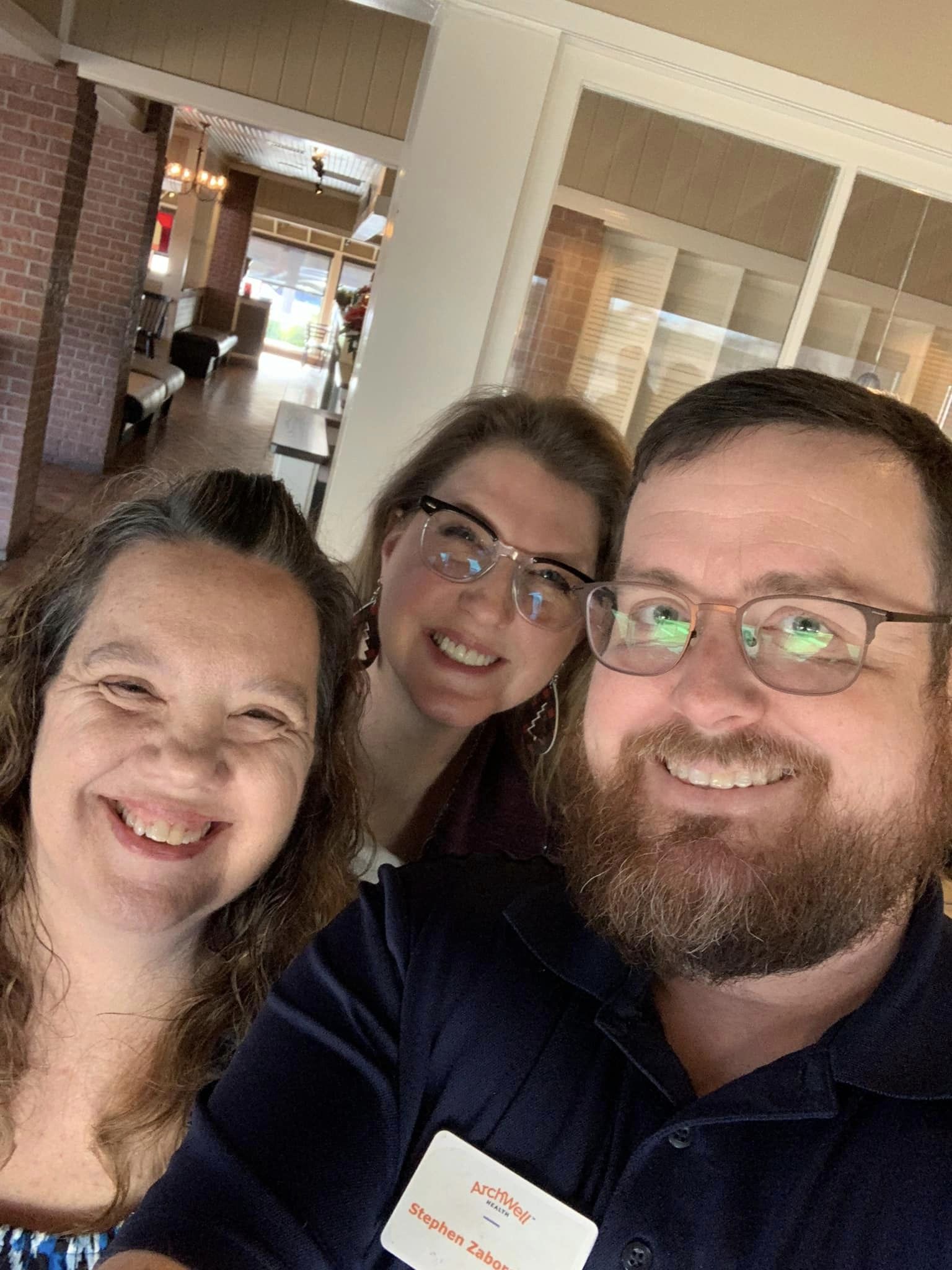 three people posing together