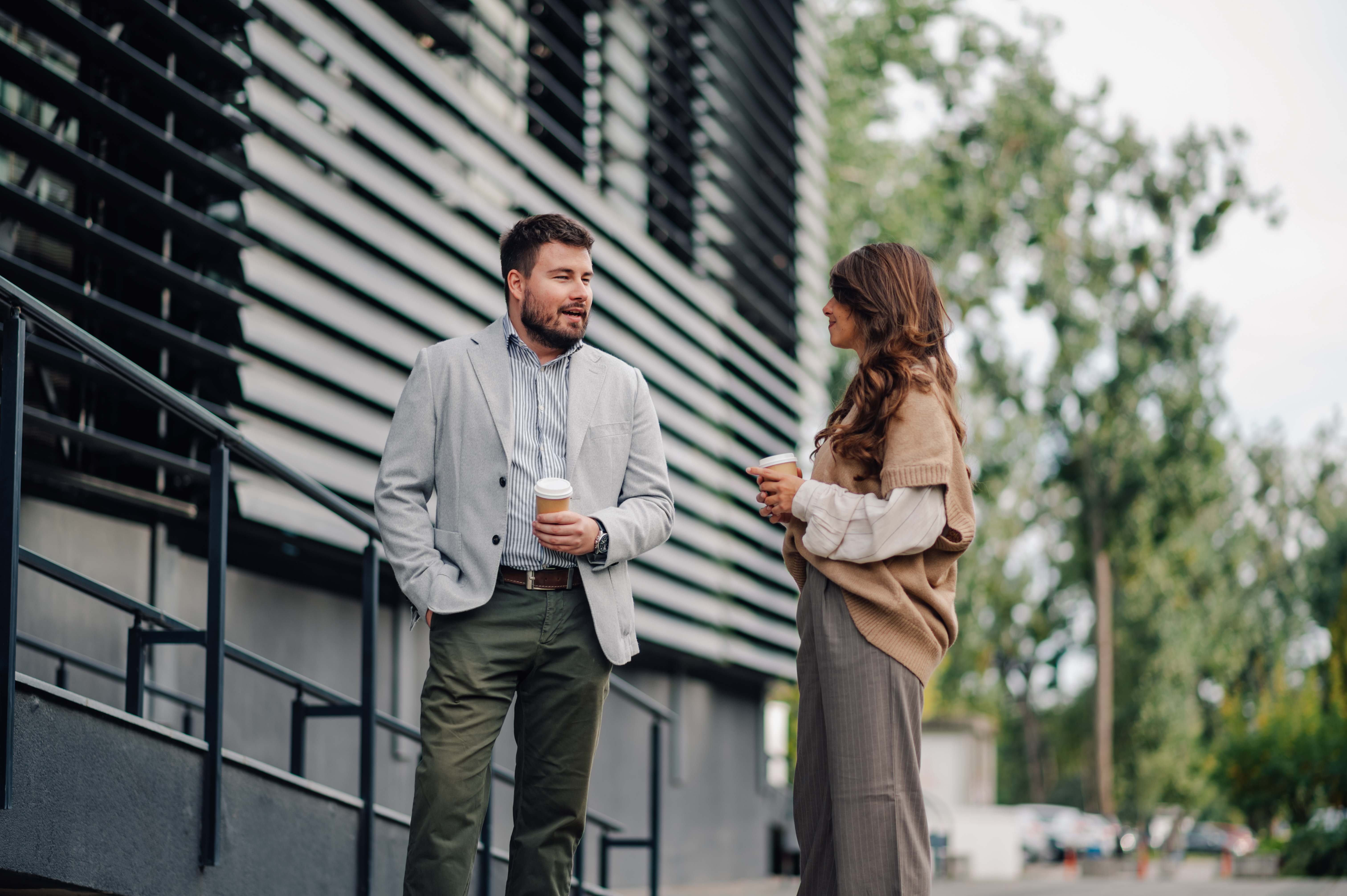two people meeting outside of a building