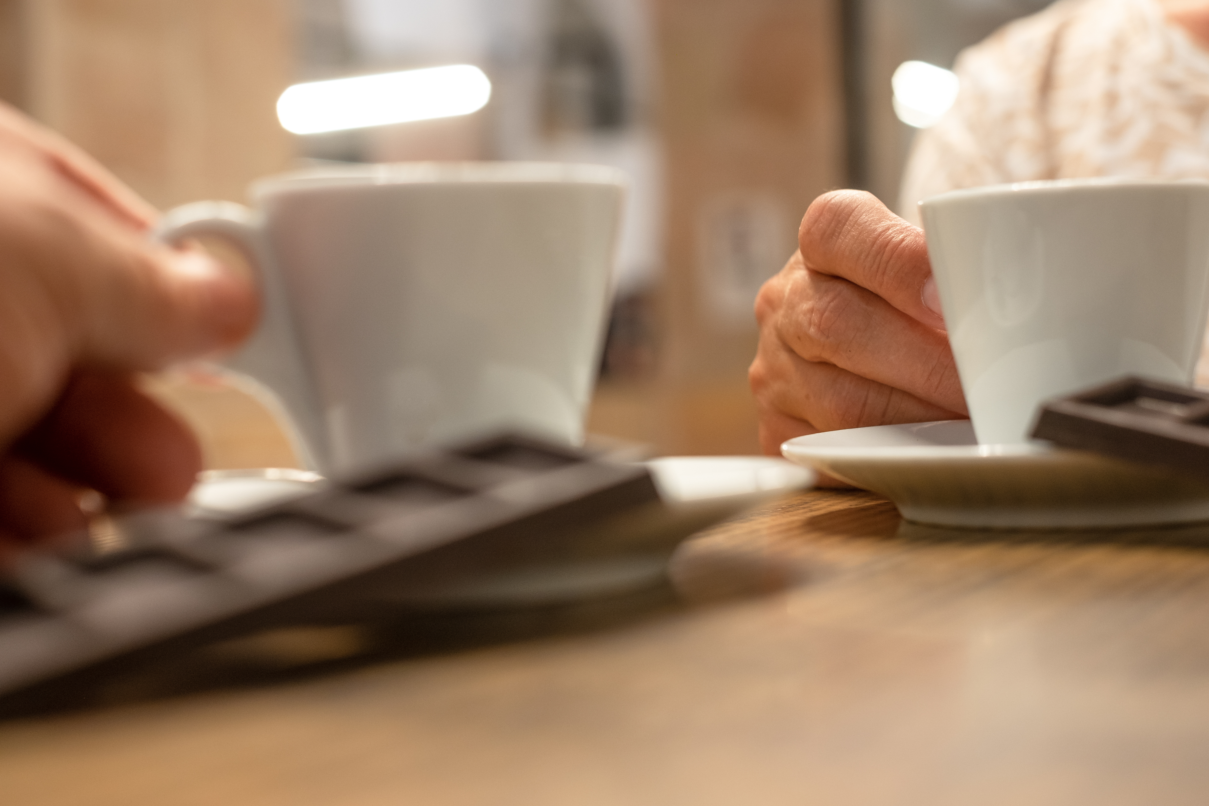 two people having coffee two people having coffee
