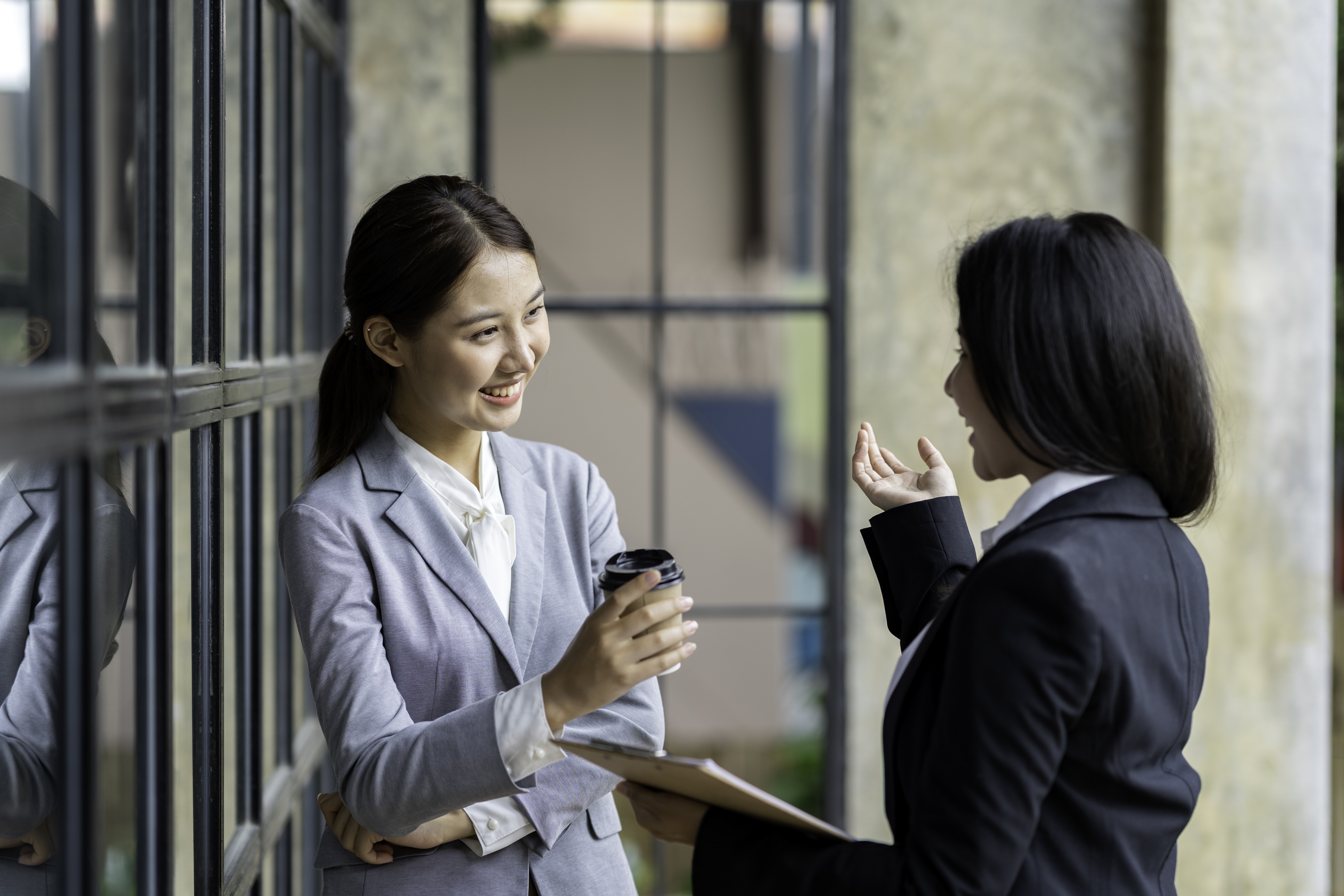 two business women talking two business women talking