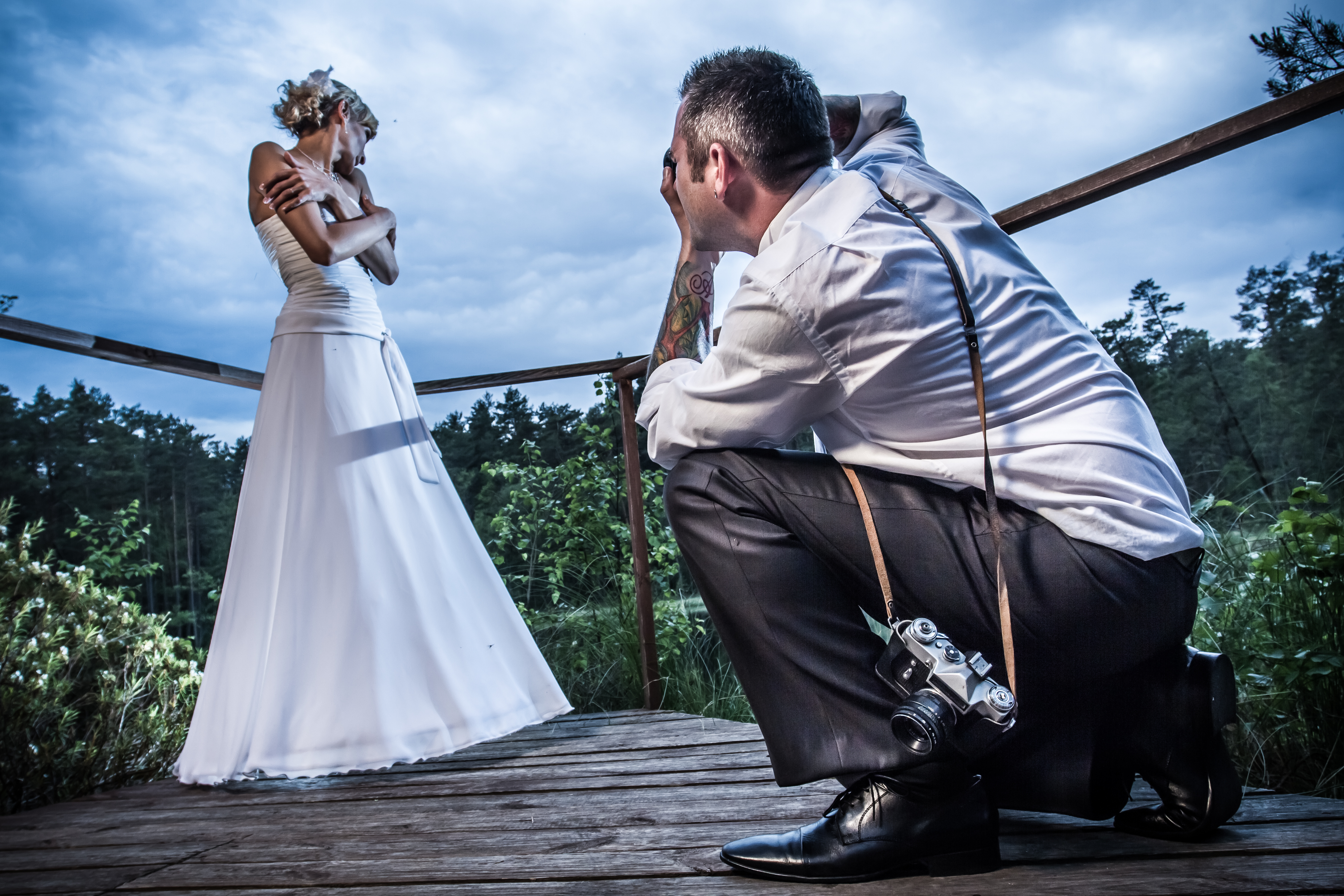 a wedding photographer taking pictures a wedding photographer taking pictures