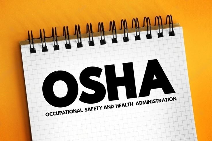 a spiral notebook that say OSHA
