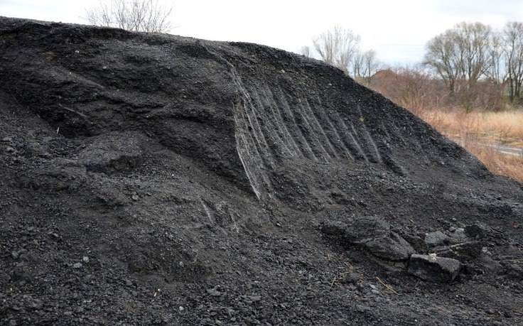 a pile of dark milled stone