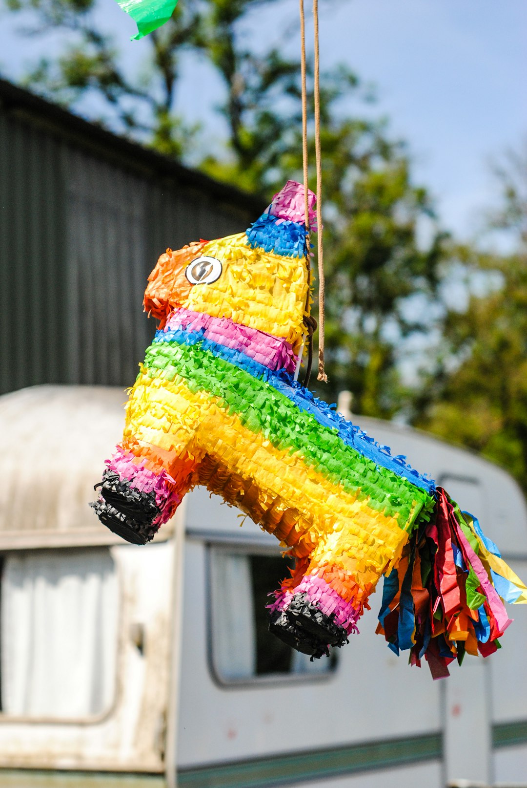 Colorful piñata suspended in midair — representing how founders swing for results without knowing where to aim until they build RevOps visibility.