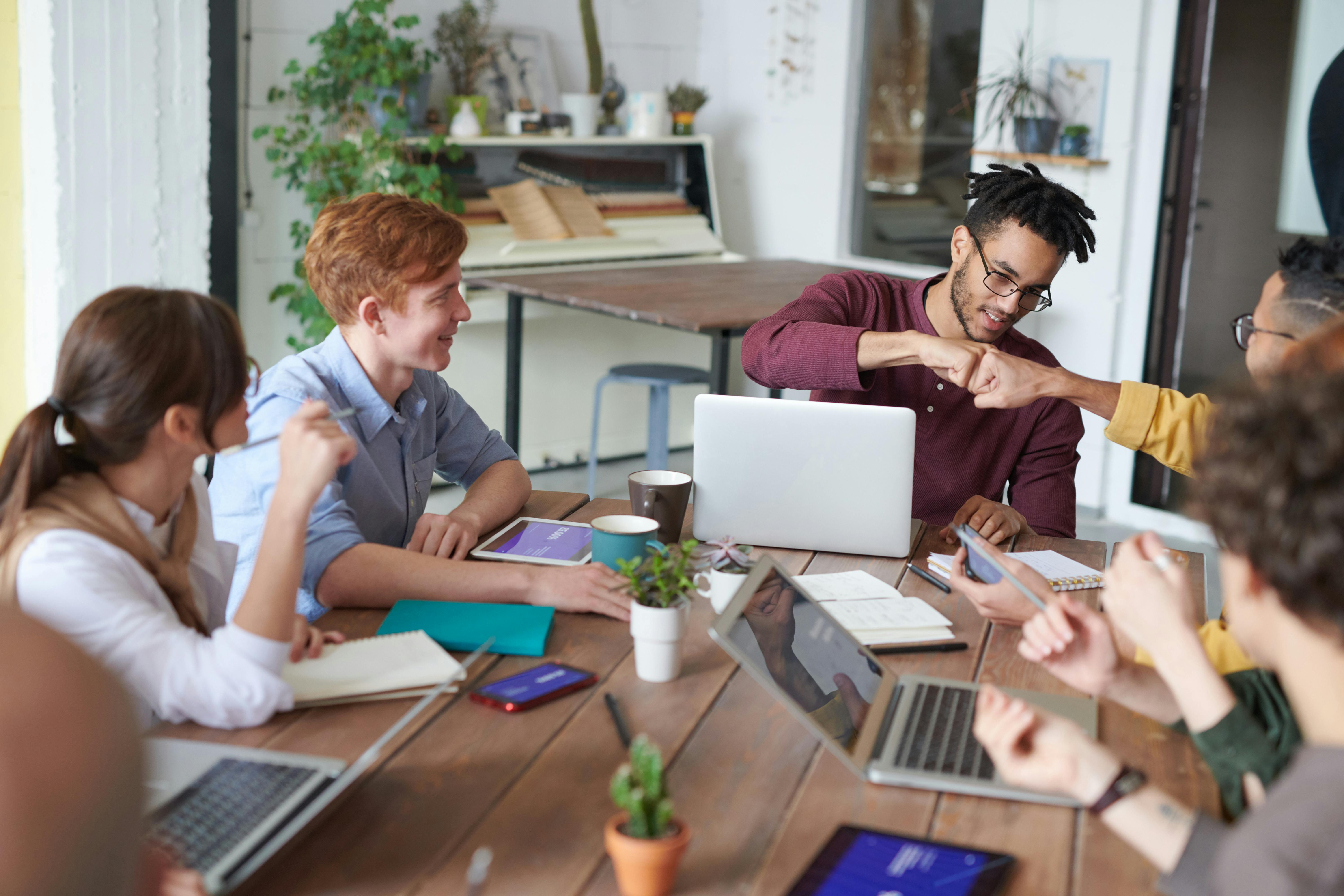 A business owner discussing employee management strategies with their team.