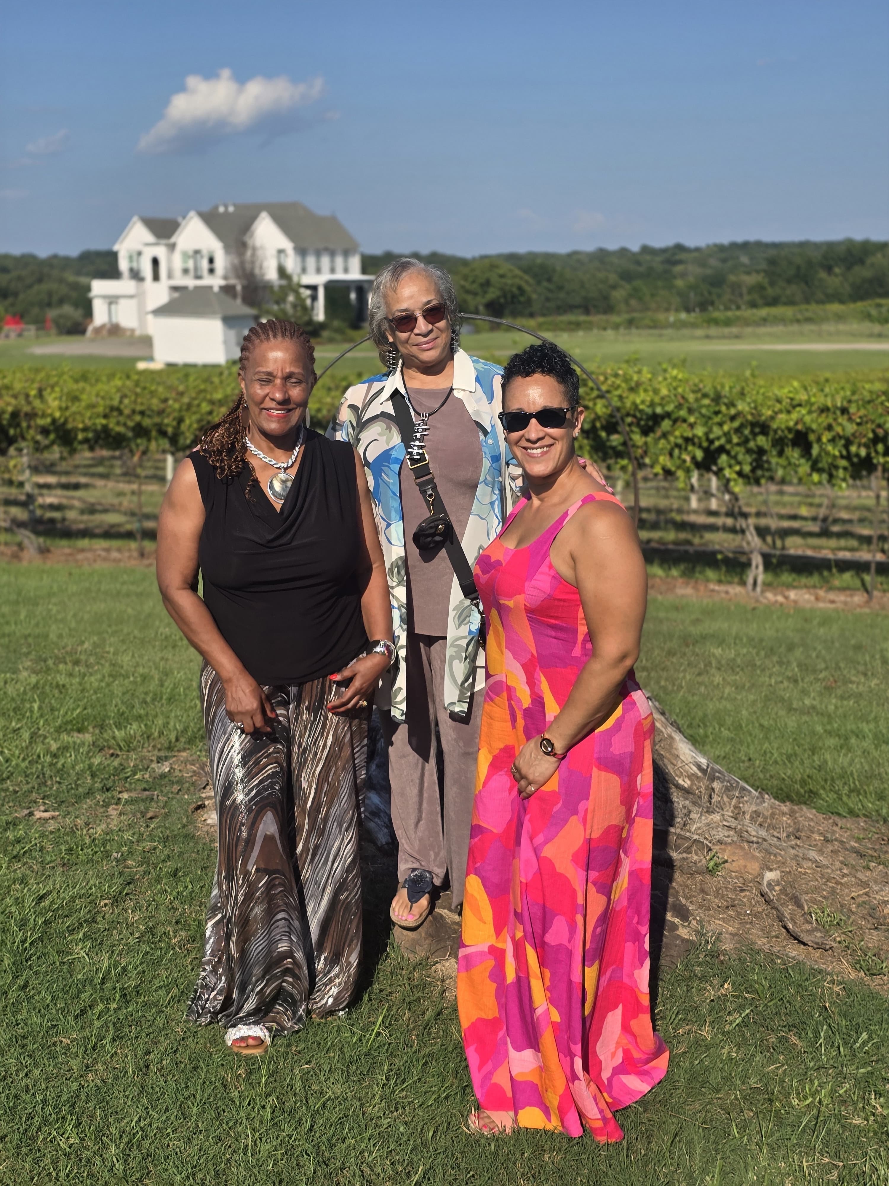 Group of friends laughing on a vineyard tour