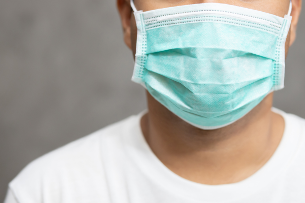 A man wearing a surgical mask