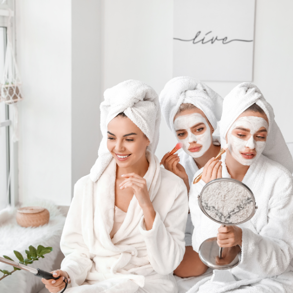 Group of women testing skincare products together