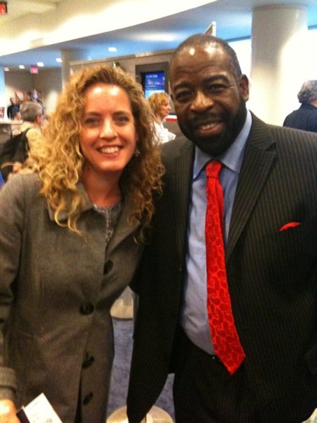 Michelle Jones and Les Brown standing together at a direct selling training event.