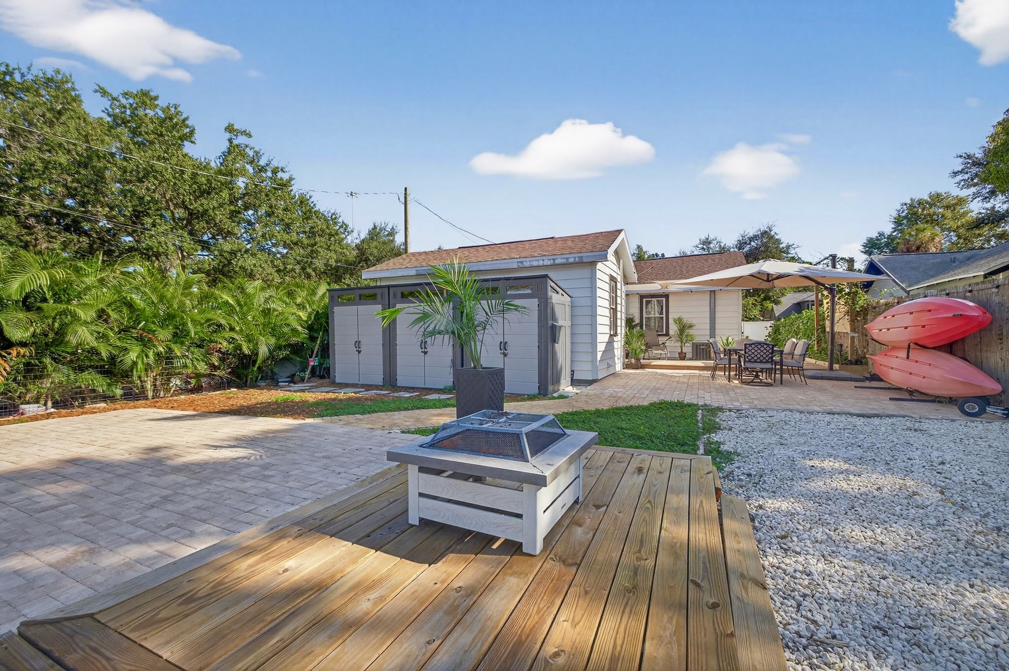 Backyard with RV or boat or trailer parking pad, driveway, sheds and more Backyard with RV or boat or trailer parking pad, driveway, sheds and more