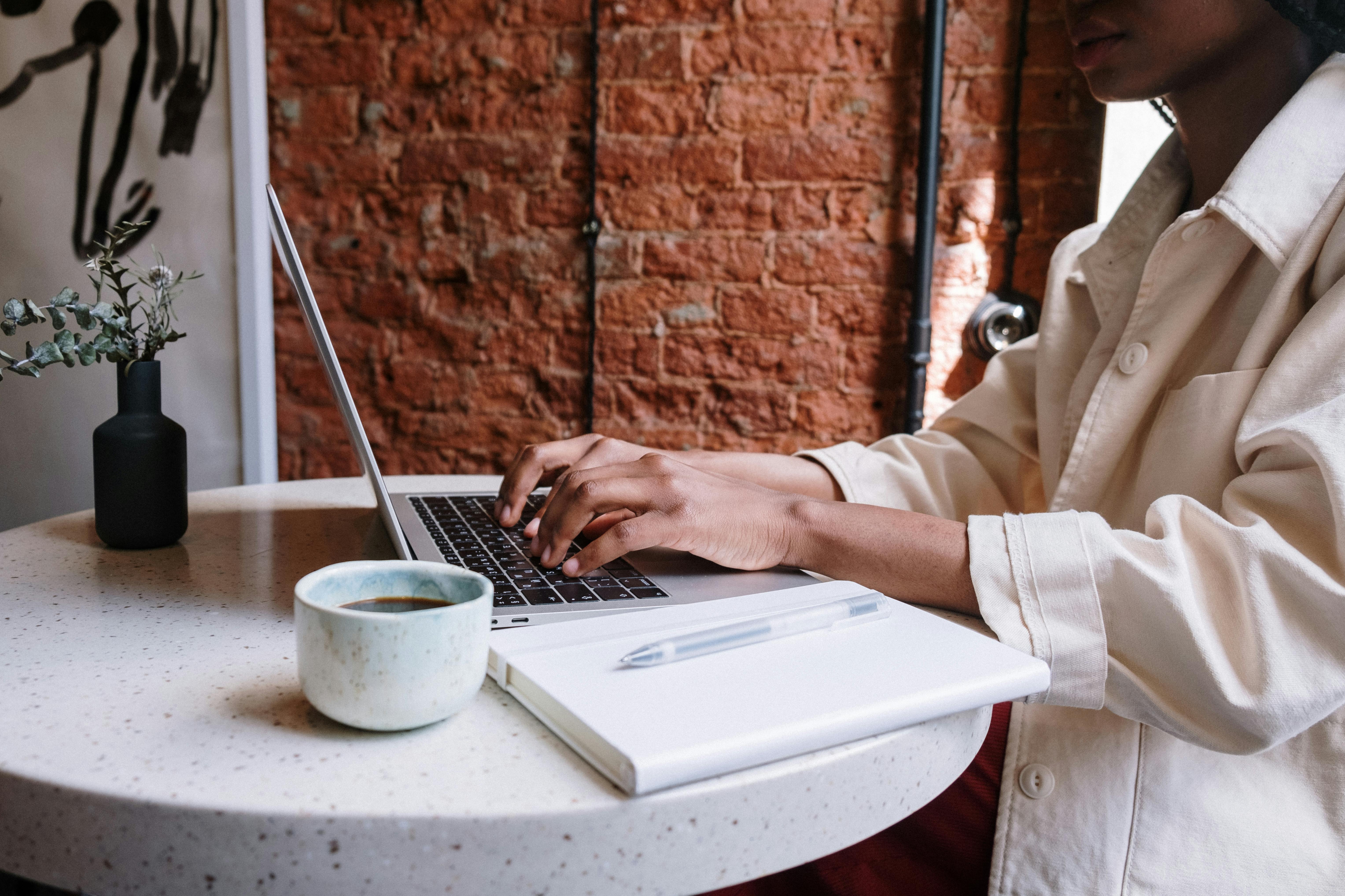 woman working on laptop optimizing seo for her blog