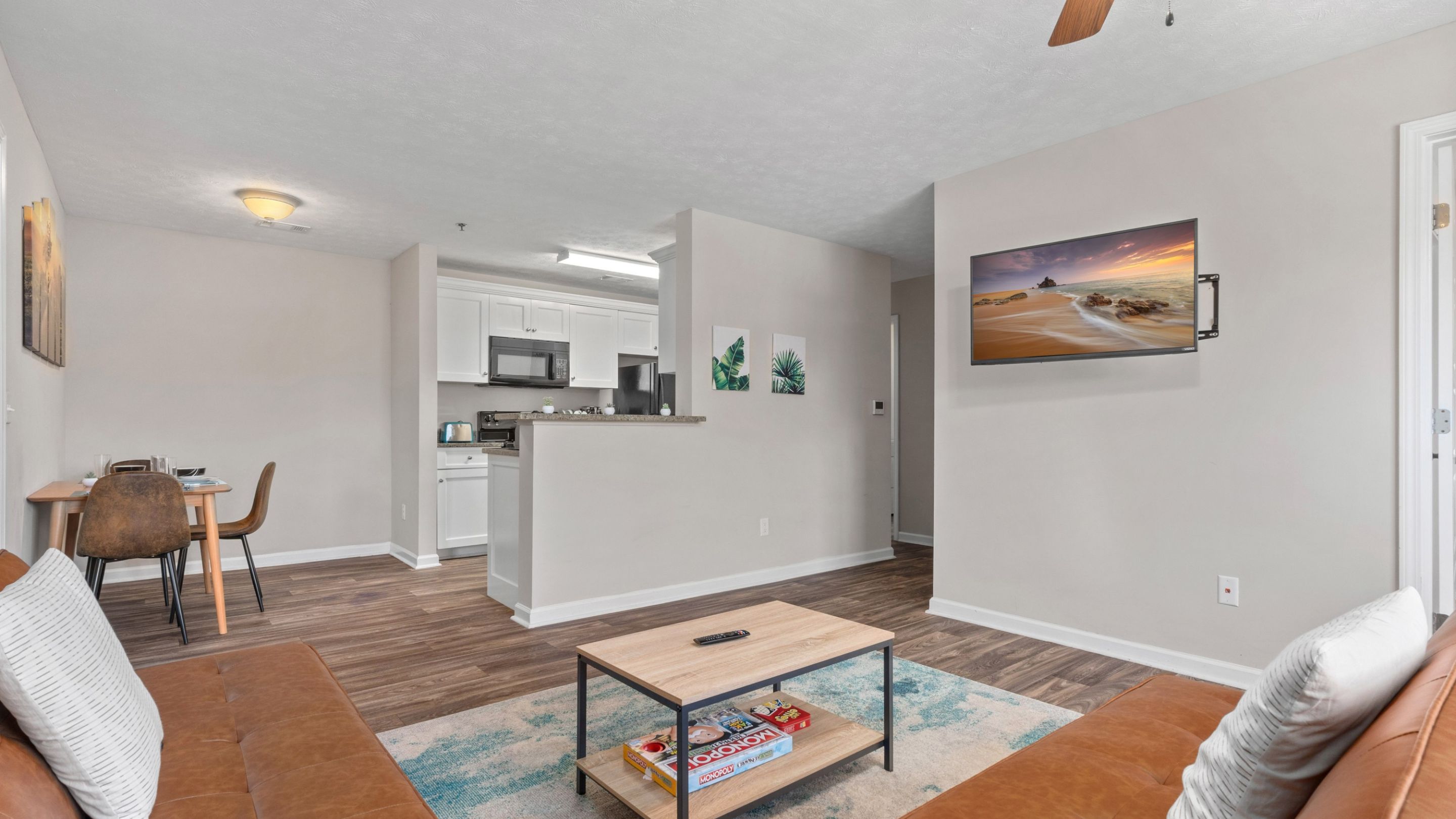 Living room view showing armchair and entryway to other rooms