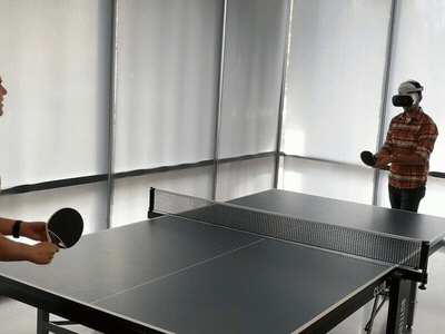 Mugur testing out XR latency by playing ping pong