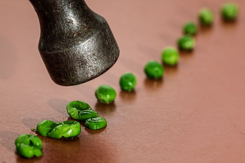 hammer crushing peas