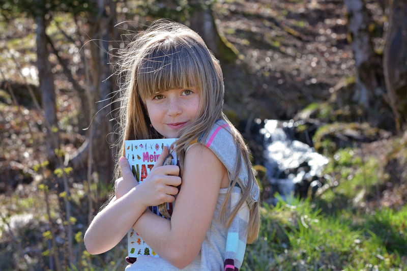 possessive girl holding book