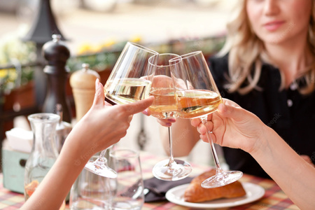 hands holding glasses white wine making toast woman cheers