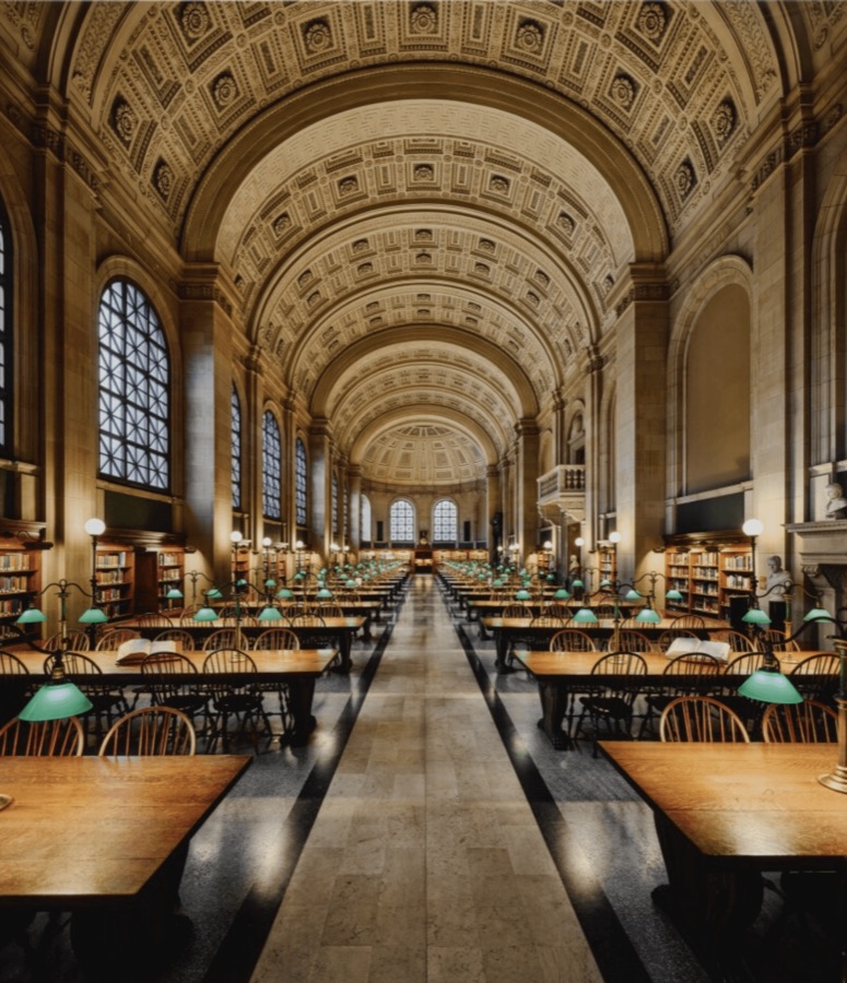 A grand library reading room with green lamps