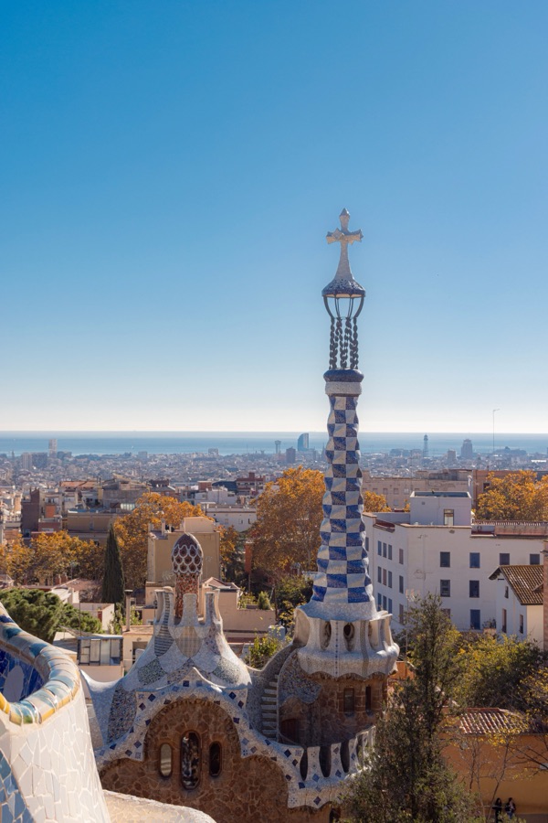 A mosaic tower in Park Güell, Barcelona, above the city