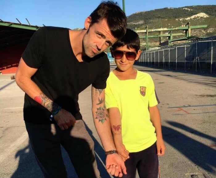 Alan Fraser and Sabim refugee child