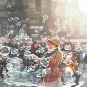 Woman surrounded by bubbles