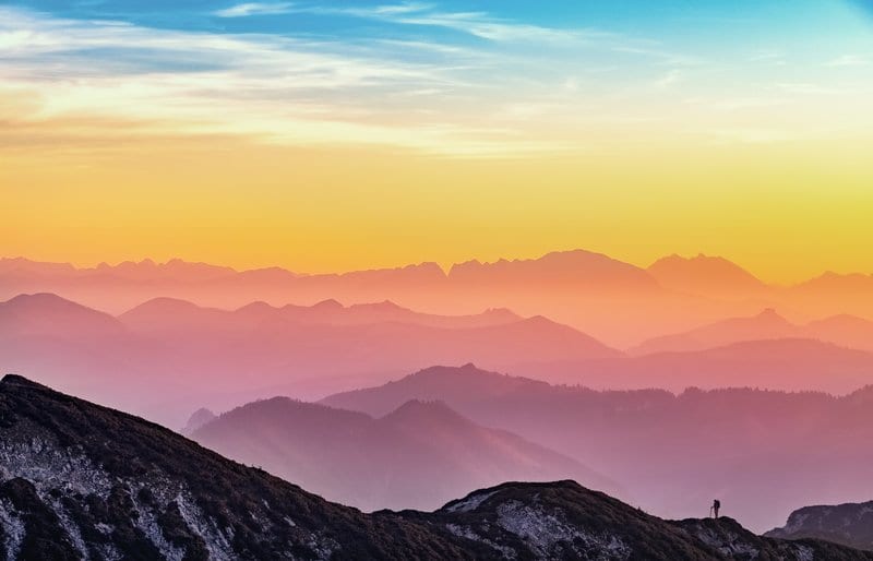 man hiking a mountain