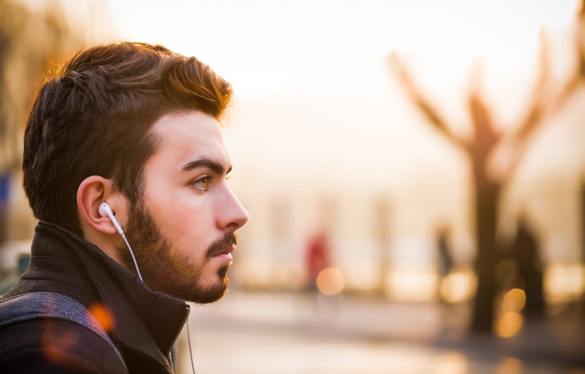 Man listening with earphones