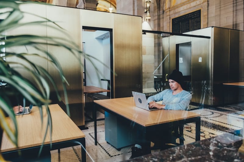 Man reading on his laptop