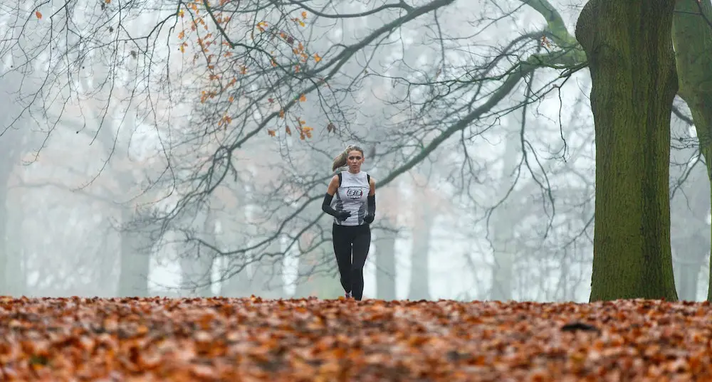 woman running in the forest