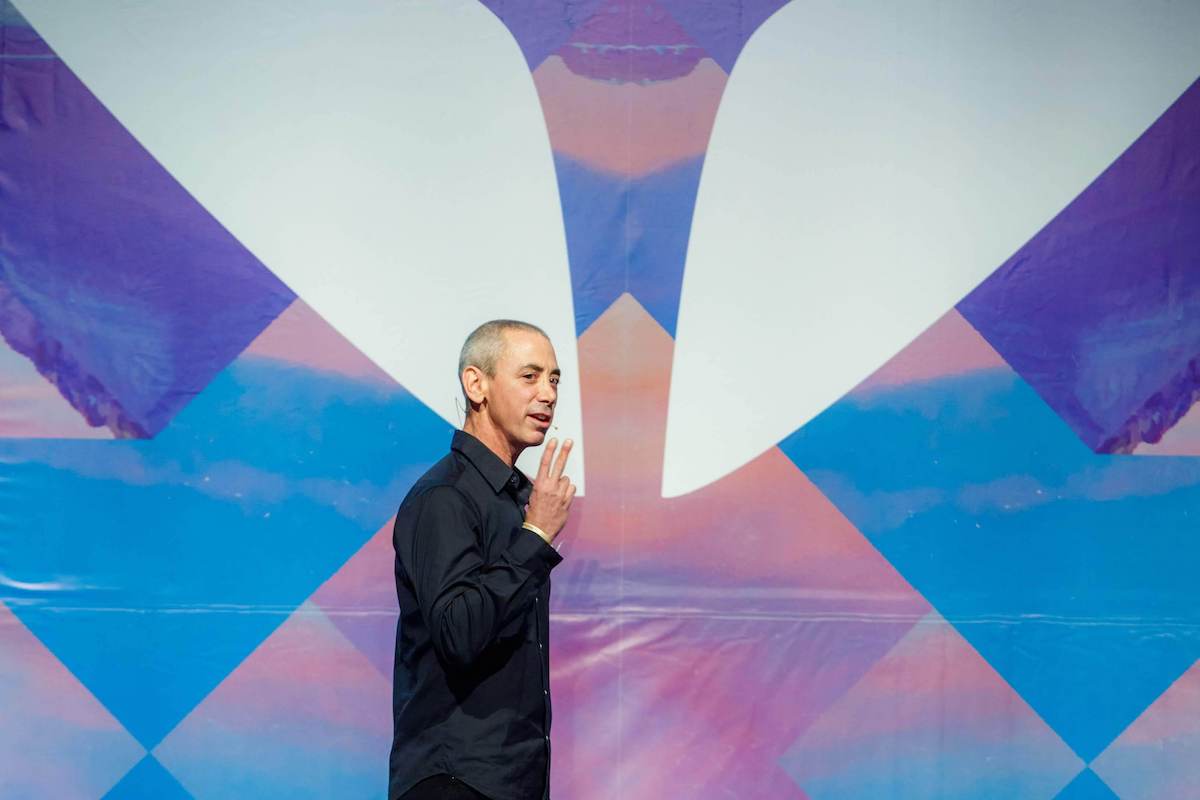 Steven Kotler, trainer of Mindvalley's The Habit of Ferocity Quest, on stage in a state of flow.