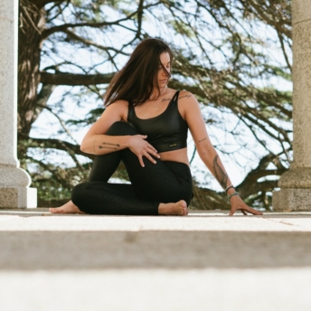 Woman doing yoga sutras outdoors