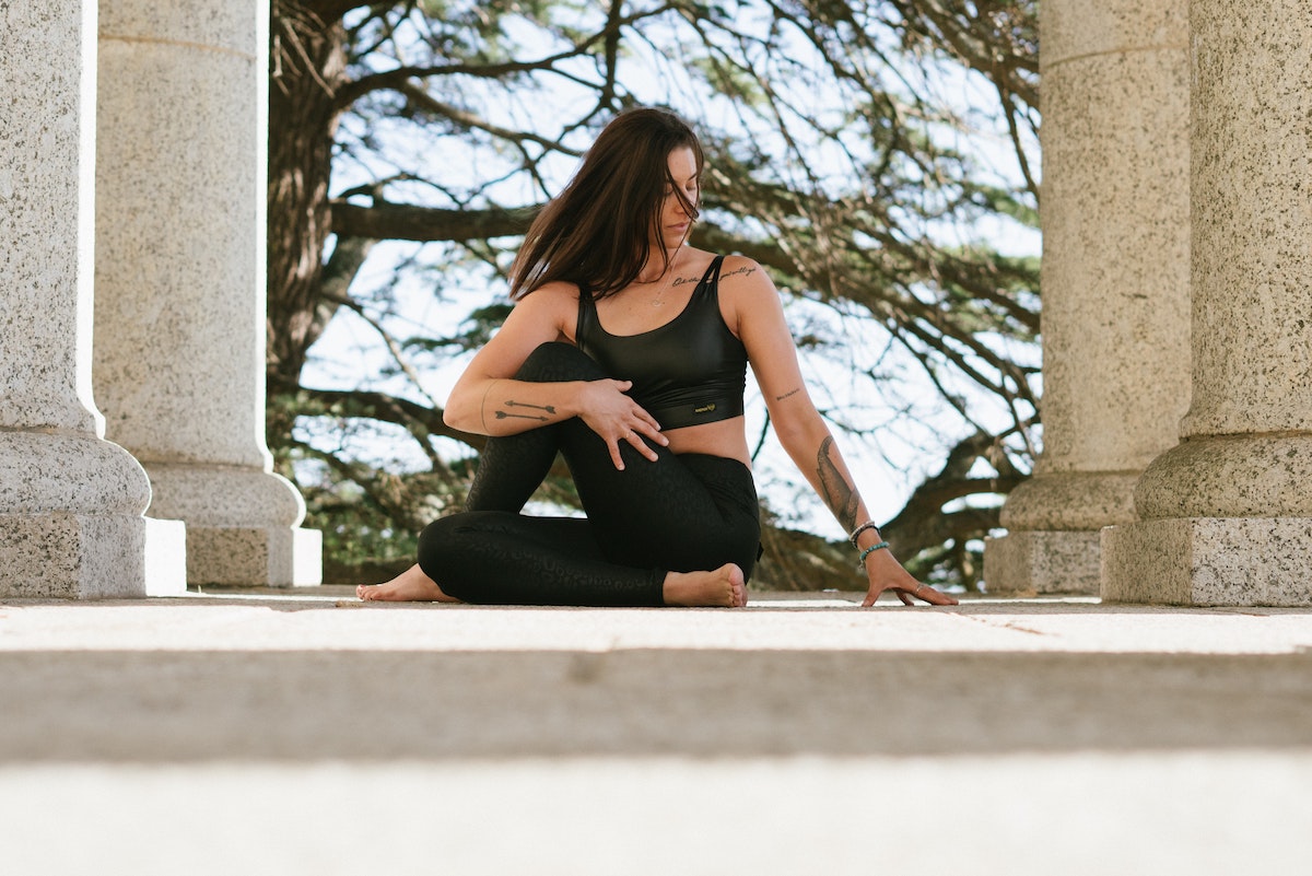 Woman doing yoga sutras outdoors