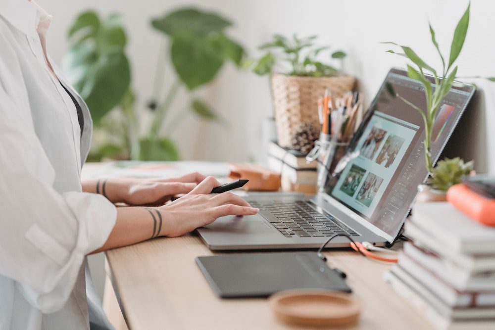 Woman looking at pictures online to make an online vision board