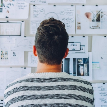 Man looking at board with analytical thinking skills