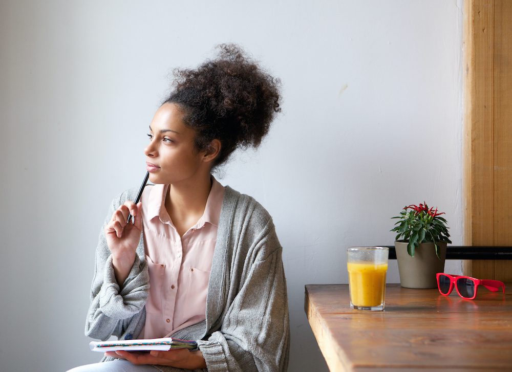 Woman thinking to stop her mind from racing