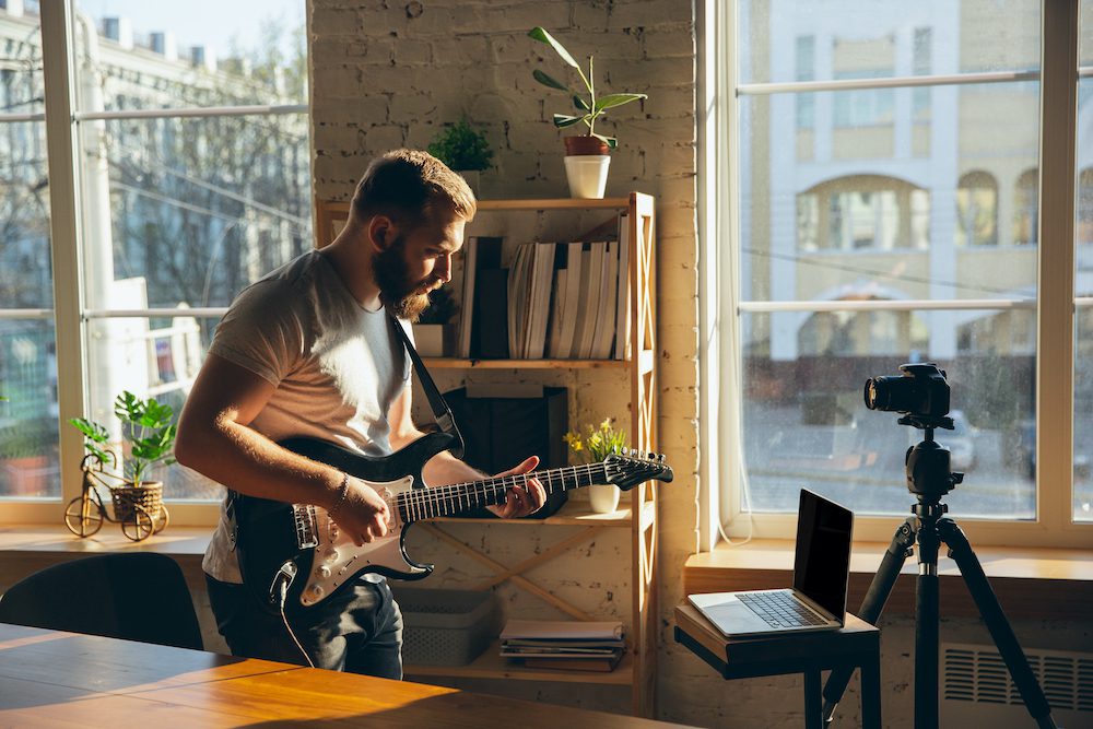 Man playing guitar for sound healing