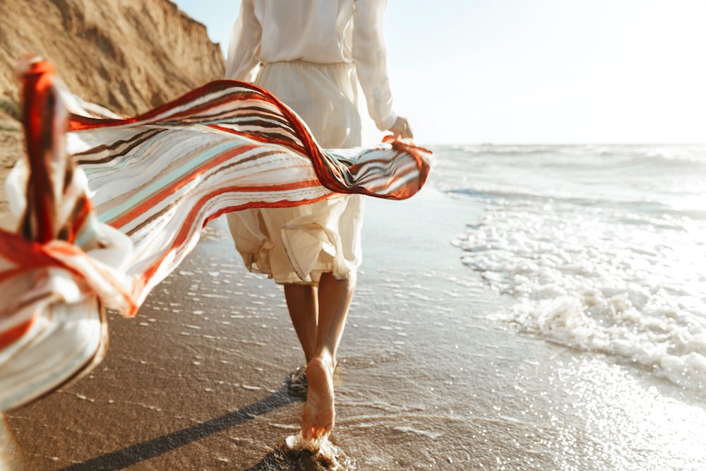 Woman walking on the beach