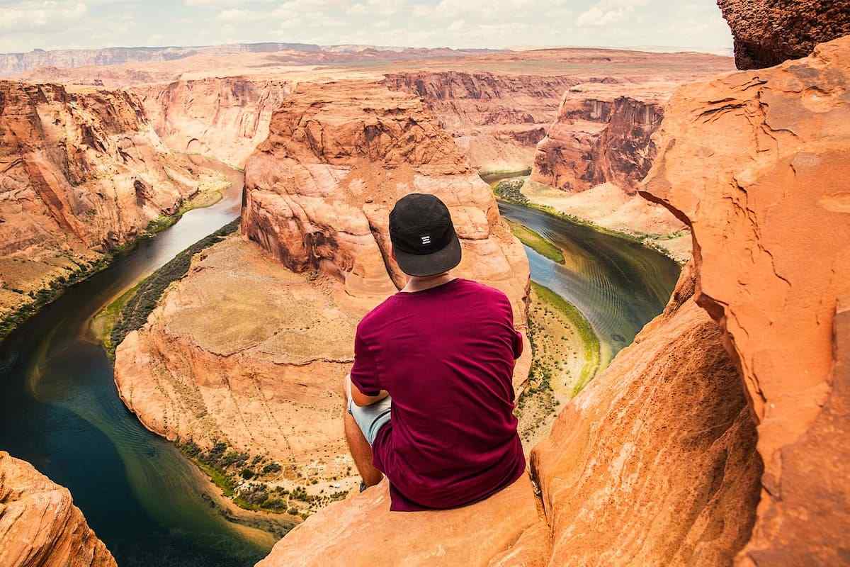 Man looking over a canyon and contemplating shifting his mindset