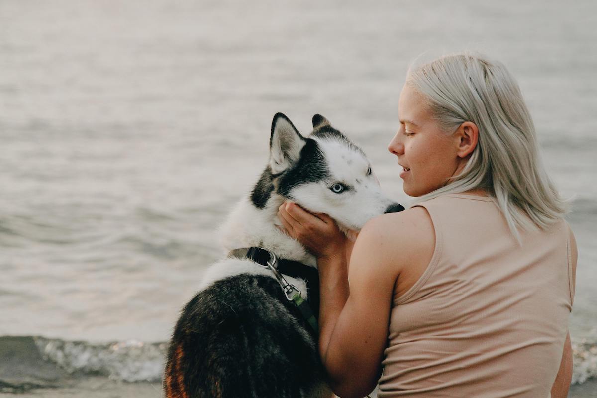 a woman with a husky