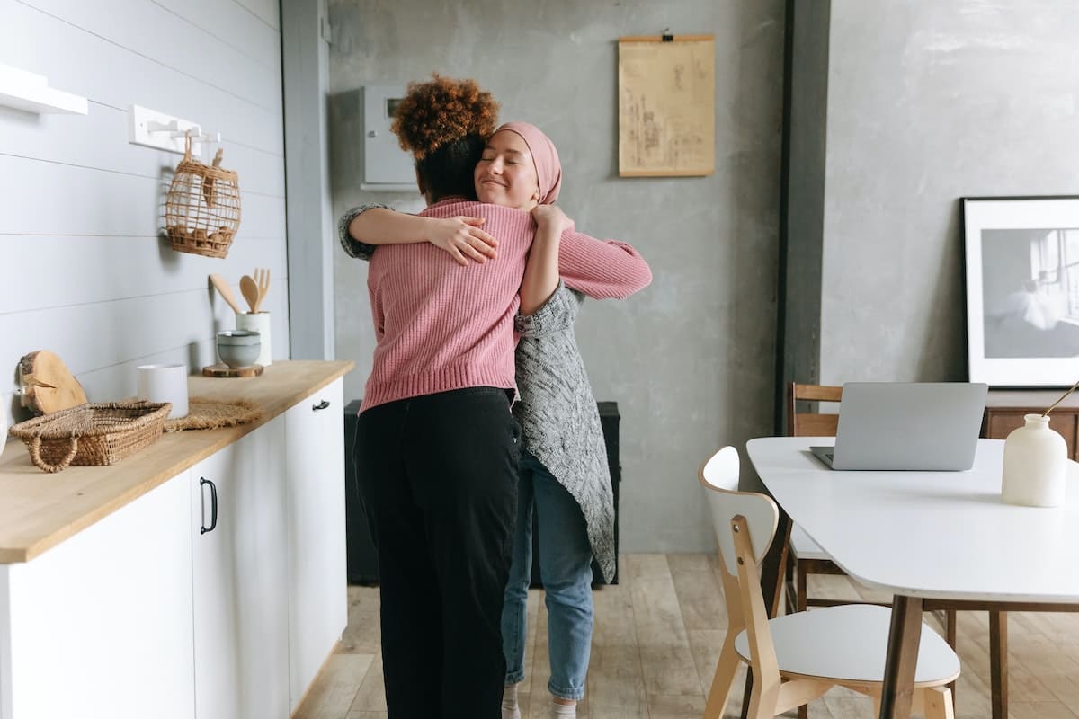 two women hugging each other