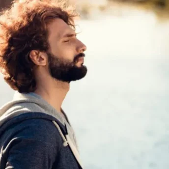 Man looking at the lake