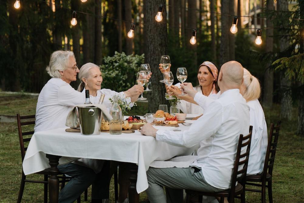 Group of old age people eating and drinking