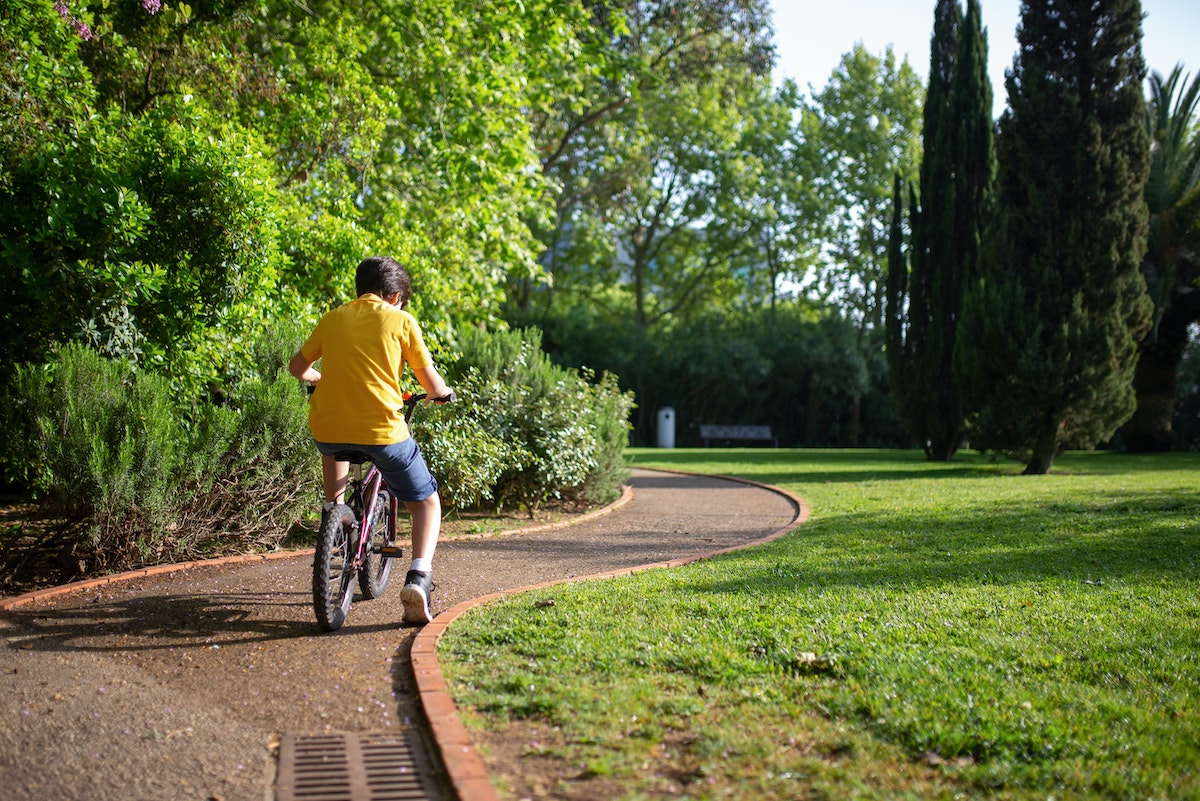 Boy riding a bike and alone due to neglectful parenting