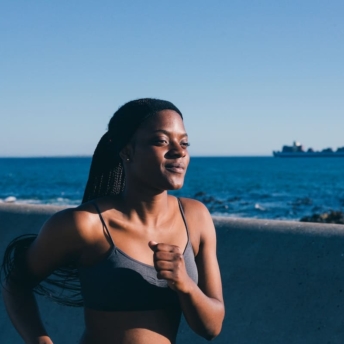 Woman running to show how long it takes to lose weight