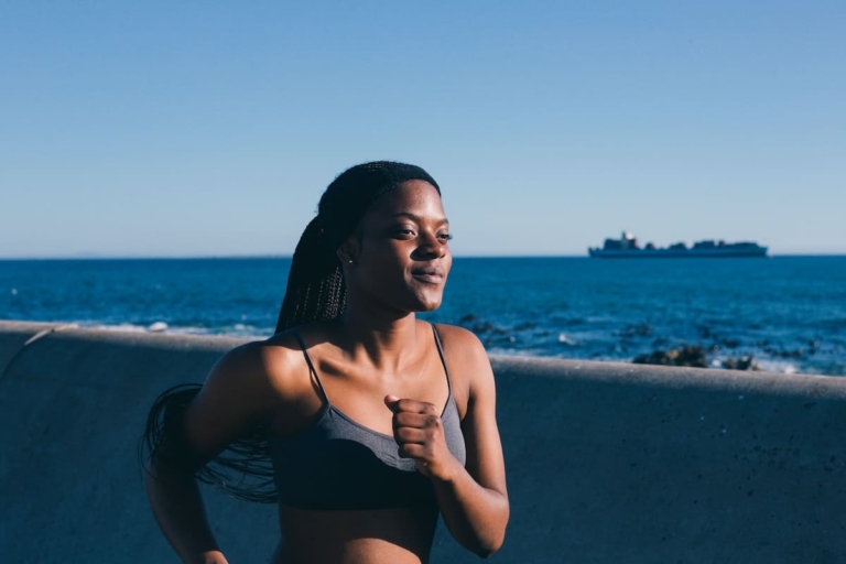 Woman running to show how long it takes to lose weight