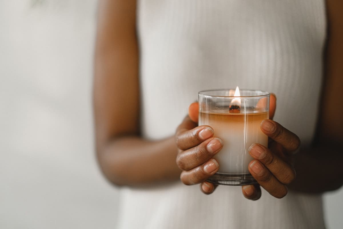 Woman holding a lit candle
